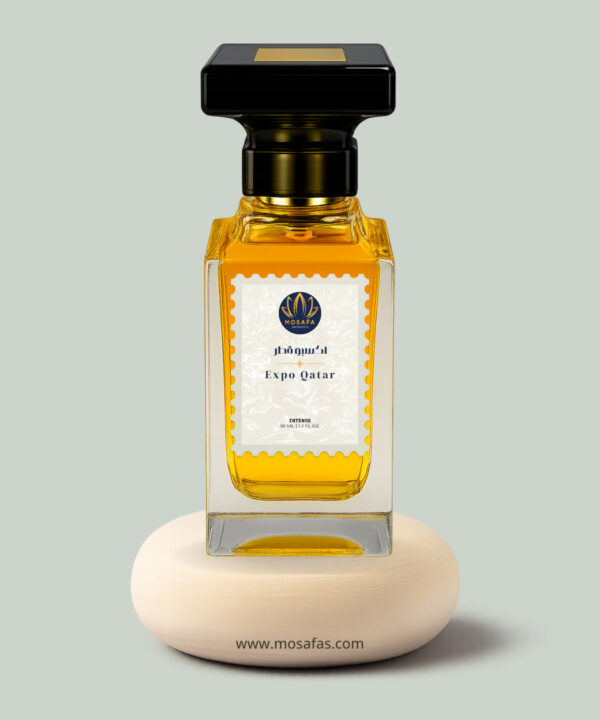 A 50ml Mosafa Aromatics perfume bottle labeled “Expo Qatar,” styled with a luxurious Oriental Fruity Woody theme and presented with warm, elegant tones.